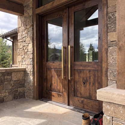 Bluff Bar pull handles in brass on a cedar entrance door