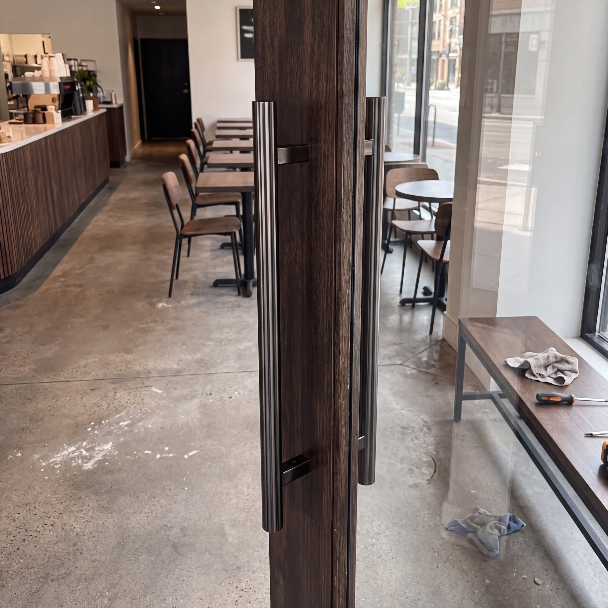 Round Tubular pull handle in matt black on an entrance door