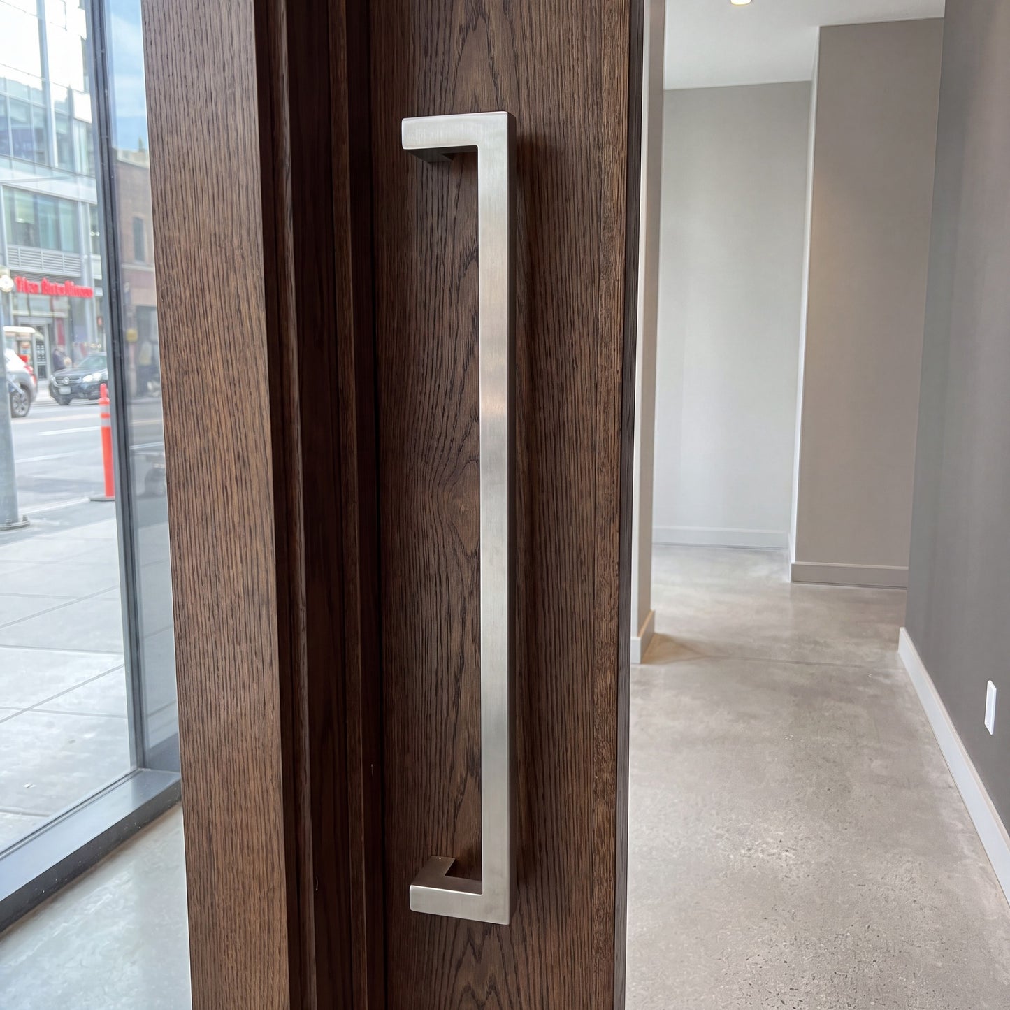 Square Offset pull handle installed on a timber door
