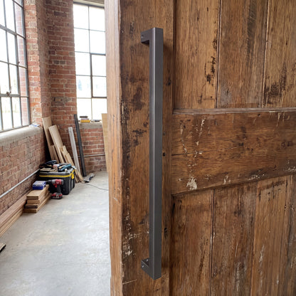 Straight Square pull handle in 316 stainless on an entrance door